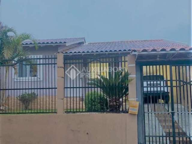 Casa em condomínio fechado com 3 quartos à venda na Rua Toríbio Cambará, 254, Jardim dos Lagos, Guaíba, 145 m2 por R$ 360.000