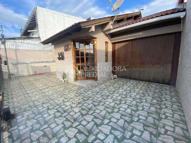 Casa em condomínio fechado com 3 quartos à venda na Rua César Passarinho, 115, Jardim dos Lagos, Guaíba, 124 m2 por R$ 380.000