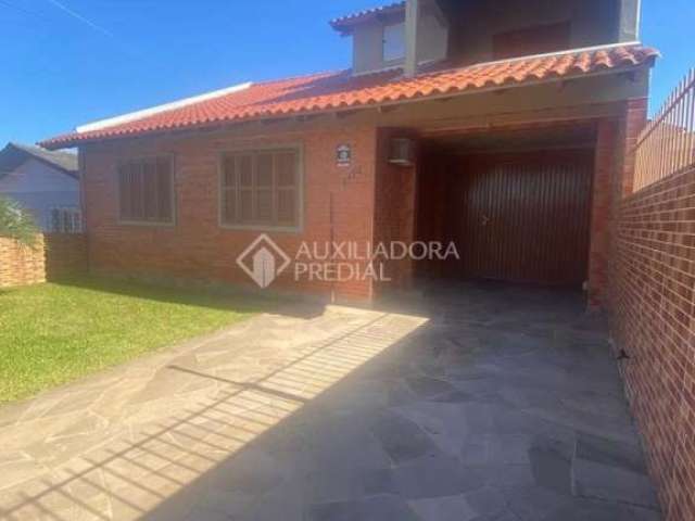 Casa em condomínio fechado com 3 quartos à venda na Rua Coronel Inácio de Quadros, 1171, Coronel Nassuca, Guaíba, 230 m2 por R$ 430.000