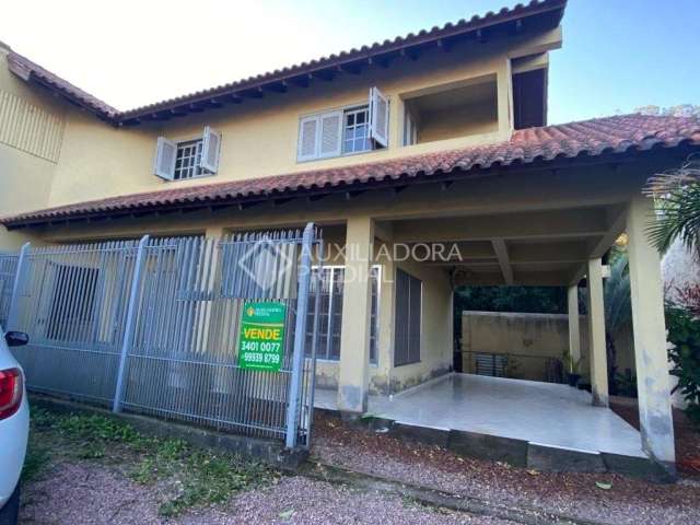 Casa em condomínio fechado com 4 quartos à venda na JOAO VIDAL, 13, Engenho, Guaíba, 210 m2 por R$ 499.000