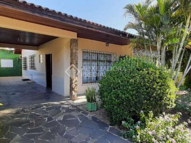 Casa em condomínio fechado com 4 quartos à venda na Avenida Gomes Jardim, 712, Alegria, Guaíba, 200 m2 por R$ 318.000