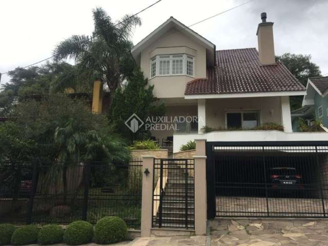 Casa em condomínio fechado com 3 quartos à venda na Rua Cangerana, 660, São Lucas, Viamão, 222 m2 por R$ 1.100.000
