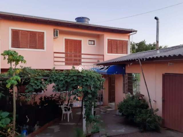 Casa com 3 quartos à venda na Rua Alfredo Varela, 509, Morada do Vale I, Gravataí, 249 m2 por R$ 450.000