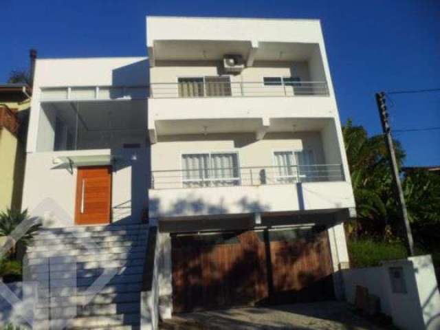 Casa em condomínio fechado com 3 quartos à venda na Avenida Senador Salgado Filho, 6614, Jardim Krahe, Viamão, 400 m2 por R$ 950.000