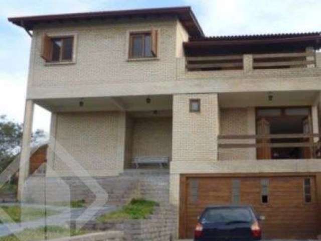 Casa em condomínio fechado com 3 quartos à venda na Estrada Capitão Gentil Machado de Godoy, 4500, Vila Elsa, Viamão, 400 m2 por R$ 750.000