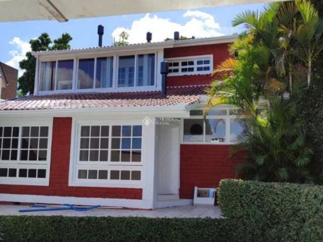 Casa em condomínio fechado com 3 quartos à venda na Rua Ângelo Passuelo, 190, Vila Nova, Porto Alegre, 238 m2 por R$ 424.000