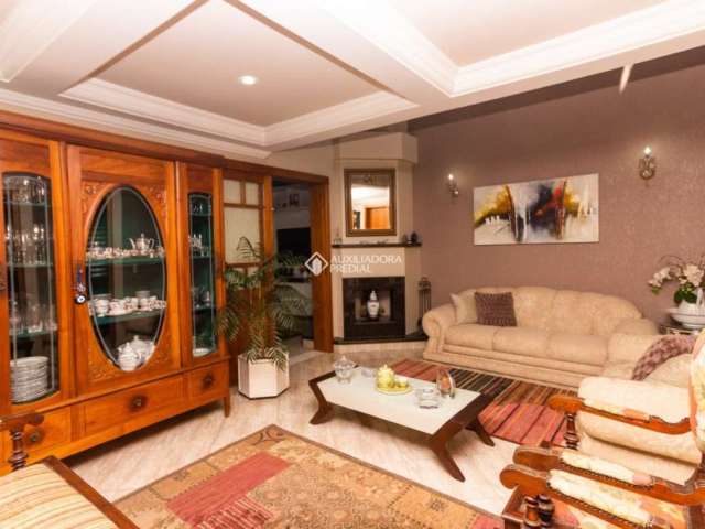 Casa com 4 quartos à venda na Rua País de Gales, 401, Marechal Rondon, Canoas, 304 m2 por R$ 1.850.000