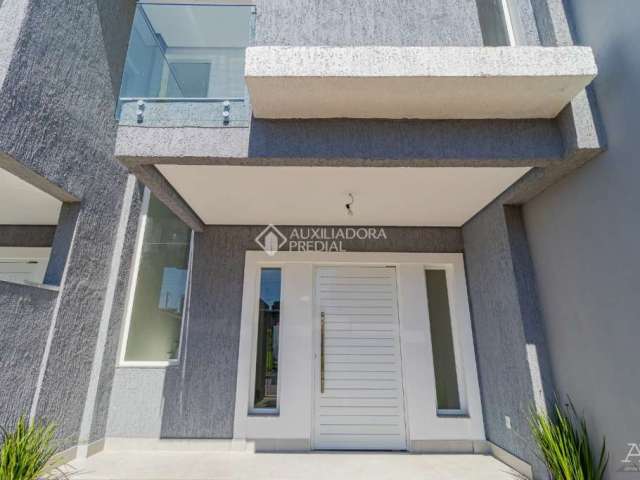 Casa com 3 quartos à venda na Rua Bréscia, 29, Estância Velha, Canoas, 125 m2 por R$ 690.000