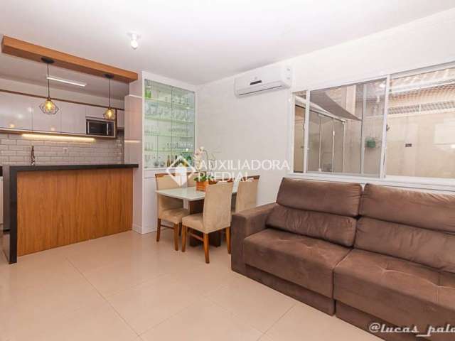 Casa em condomínio fechado com 2 quartos à venda na Rua Dezoito, 376, Olaria, Canoas, 54 m2 por R$ 329.900