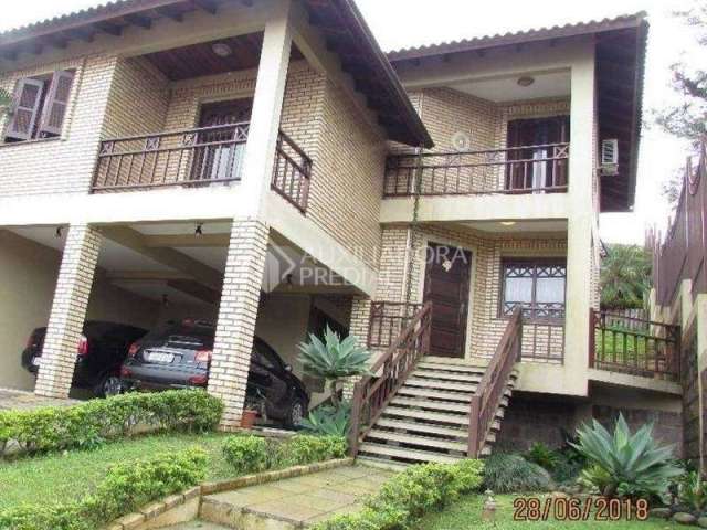 Casa em condomínio fechado com 3 quartos à venda na Rua Fernando de Andrade Prates, 172, Centro, Viamão, 162 m2 por R$ 680.000