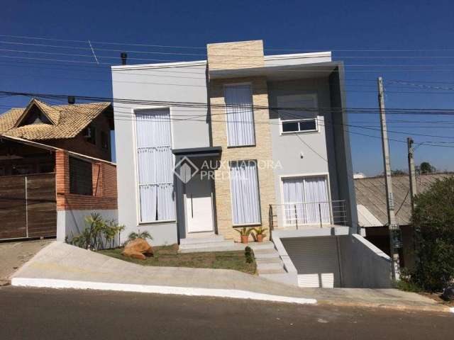 Casa em condomínio fechado com 3 quartos à venda na Rua Ivan Maciel, 119, Loteamento Jardim Timbaúva, Gravataí, 180 m2 por R$ 1.189.150