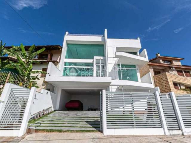 Casa em condomínio fechado com 3 quartos à venda na Rua Alcebíades Antônio dos Santos, 605, Nonoai, Porto Alegre, 326 m2 por R$ 1.490.000