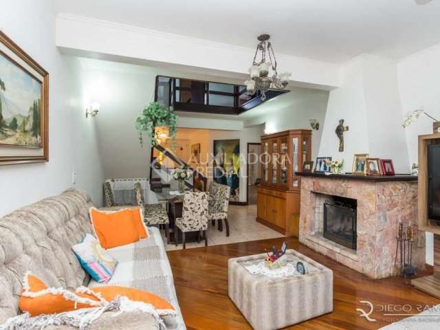 Casa em condomínio fechado com 4 quartos à venda na Rua Monte Alegre, 137, Jardim Floresta, Porto Alegre, 340 m2 por R$ 1.100.000
