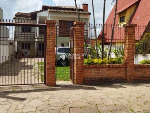 Casa com 7 quartos à venda na Rua General Telino Chagastelles, 75, Parque Santa Fé, Porto Alegre, 270 m2 por R$ 600.000