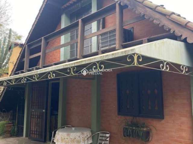 Casa com 2 quartos à venda na Rua Capitão Coelho, 379, Arquipélago, Porto Alegre, 165 m2 por R$ 695.000