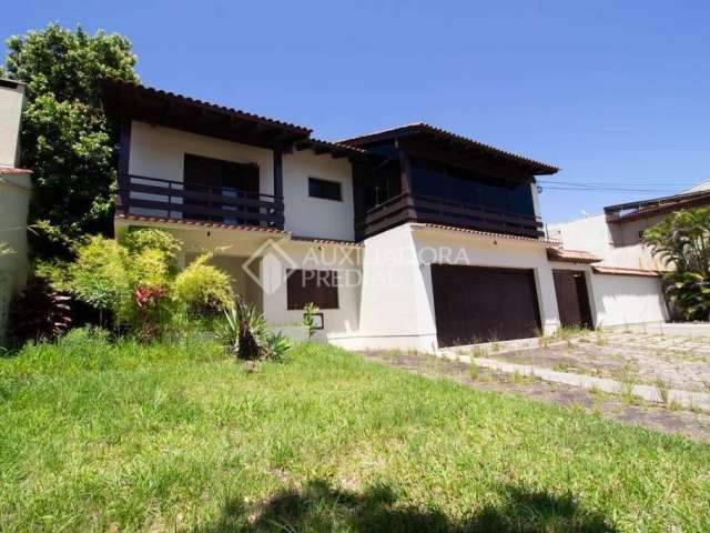 Casa em condomínio fechado com 4 quartos para alugar na Avenida Saul Nonnenmacher, 77, Aberta dos Morros, Porto Alegre, 850 m2 por R$ 12.000