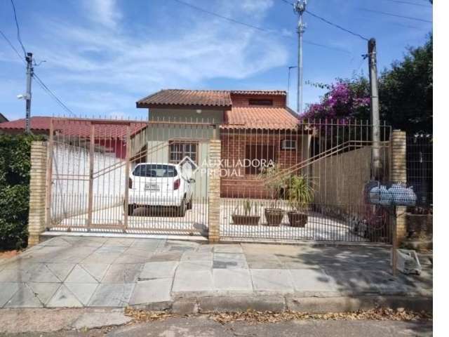 Casa com 3 quartos à venda na Rua Biguás, 544, Jardim Algarve, Alvorada, 70 m2 por R$ 295.000