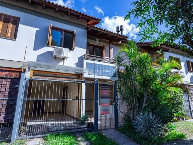 Casa em condomínio fechado com 3 quartos à venda na Rua Itapitocaí, 1043, Cristal, Porto Alegre, 105 m2 por R$ 465.000