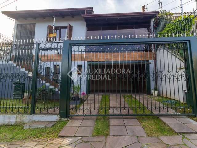 Casa com 3 quartos à venda na Rua Doutor Egydio Michaelsen, 250, Cavalhada, Porto Alegre, 292 m2 por R$ 1.044.000
