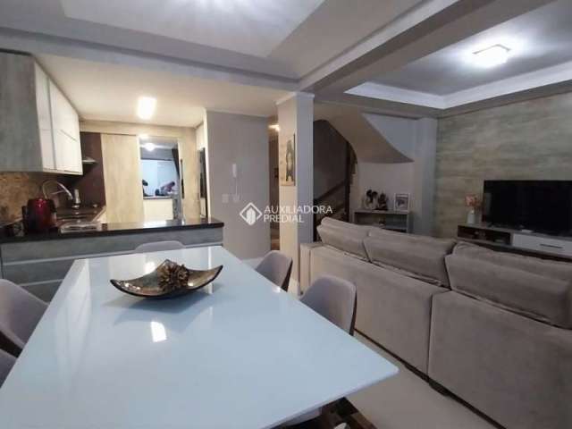 Casa em condomínio fechado com 3 quartos à venda na Avenida Açucena, 650, Estância Velha, Canoas, 156 m2 por R$ 946.800