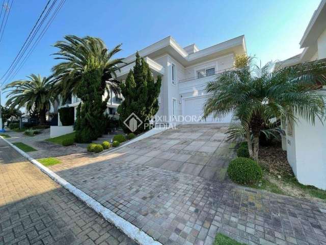 Casa em condomínio fechado com 3 quartos à venda na Avenida Açucena, 50, Estância Velha, Canoas, 400 m2 por R$ 2.990.000
