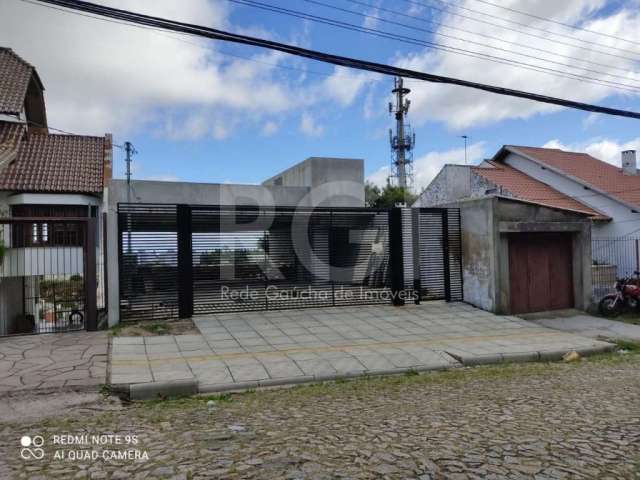 Casa com 3 quartos à venda na Rua Tomaz Edison, Santo Antônio, Porto Alegre, 225 m2 por R$ 680.000