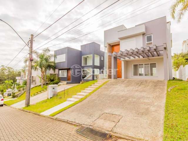 Casa em condomínio fechado com 3 quartos à venda na Avenida Senador Salgado Filho, 8500, Jardim Krahe, Viamão, 197 m2 por R$ 1.390.000