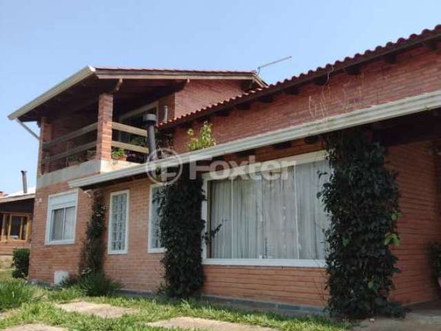 Casa em condomínio fechado com 3 quartos à venda na Estrada dos Guterres, 2565, Fiuza, Viamão, 327 m2 por R$ 550.000