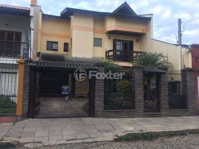 Casa com 4 quartos à venda na Rua Antônio Ribeiro, 70, Santo Antônio, Porto Alegre, 395 m2 por R$ 2.200.000