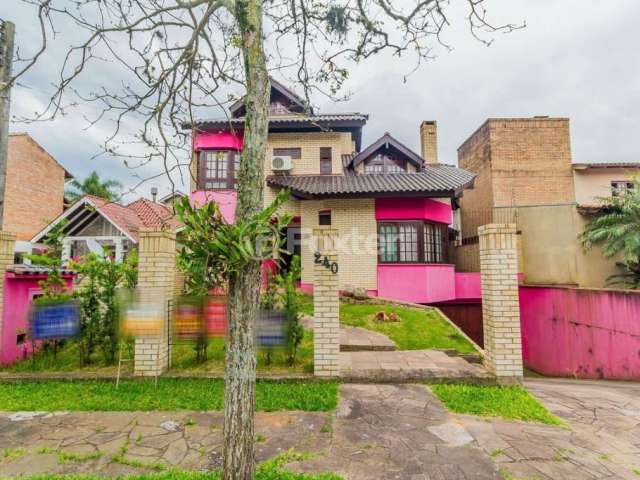 Casa em condomínio fechado com 4 quartos à venda na Rua Jacarandá, 240, Santo Onofre, Viamão, 334 m2 por R$ 850.000