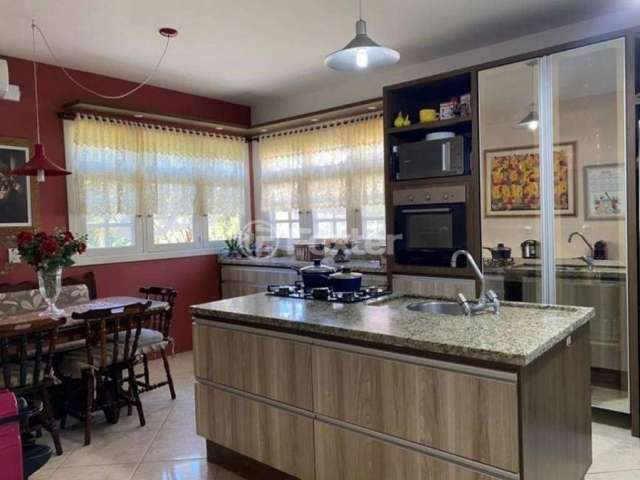 Casa em condomínio fechado com 3 quartos à venda na Estrada Capitão Gentil Machado de Godoy, 4500, Vila Elsa, Viamão, 309 m2 por R$ 990.000