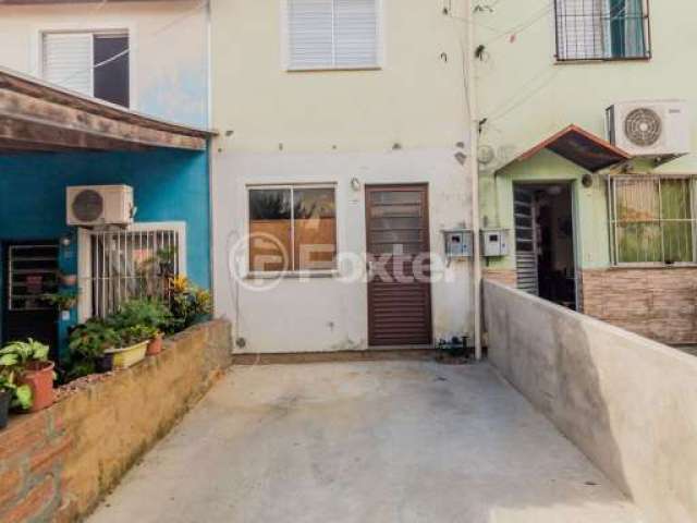Casa em condomínio fechado com 2 quartos à venda na Rua Alcebíades Azeredo dos Santos, 650, Cecília, Viamão, 45 m2 por R$ 150.000