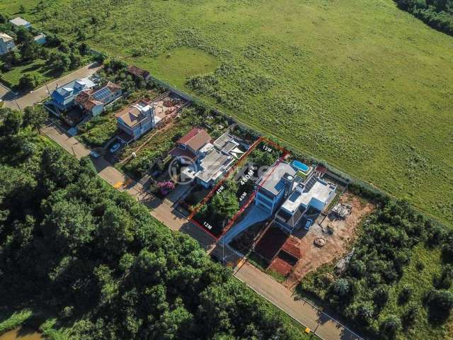Terreno em condomínio fechado à venda na Rua Capororoca, 512, São Lucas, Viamão, 480 m2 por R$ 160.000
