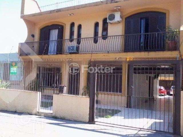 Casa com 4 quartos à venda na Rua Márcio Dias, 340, Nonoai, Porto Alegre, 450 m2 por R$ 700.000