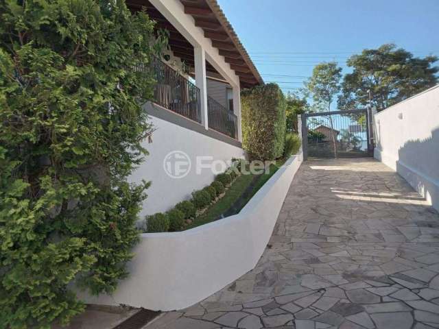 Casa em condomínio fechado com 4 quartos à venda na Rua Cipreste, 60, Fiuza, Viamão, 316 m2 por R$ 1.250.000