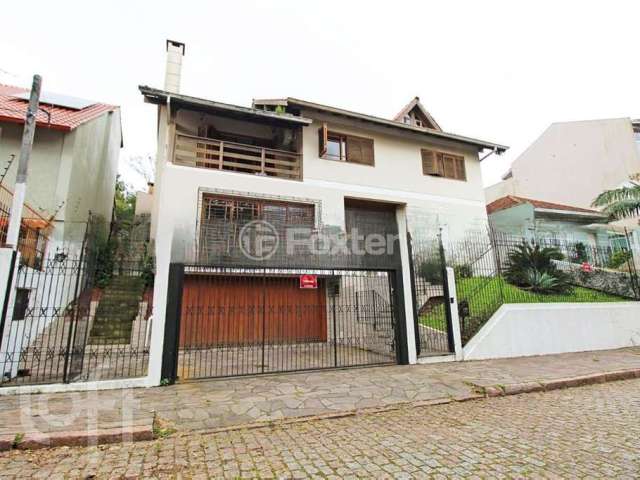 Casa com 4 quartos à venda na Rua Antônio Ribeiro, 391, Santo Antônio, Porto Alegre, 474 m2 por R$ 1.800.000
