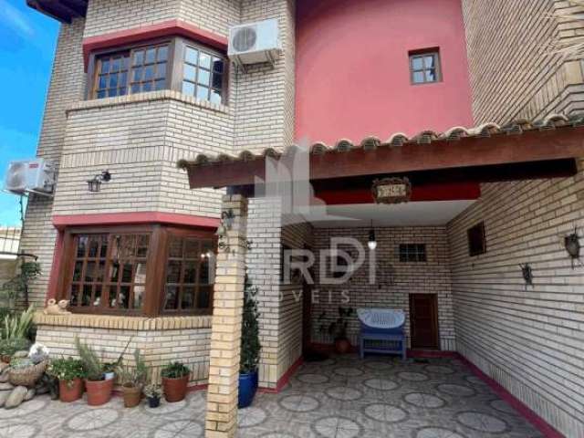 Casa com 3 quartos à venda na Rua Jacundá, 641, Guarujá, Porto Alegre por R$ 585.000