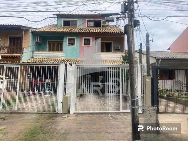 Casa com 2 quartos à venda na Rua James Bocacio, 96, Hípica, Porto Alegre por R$ 550.000