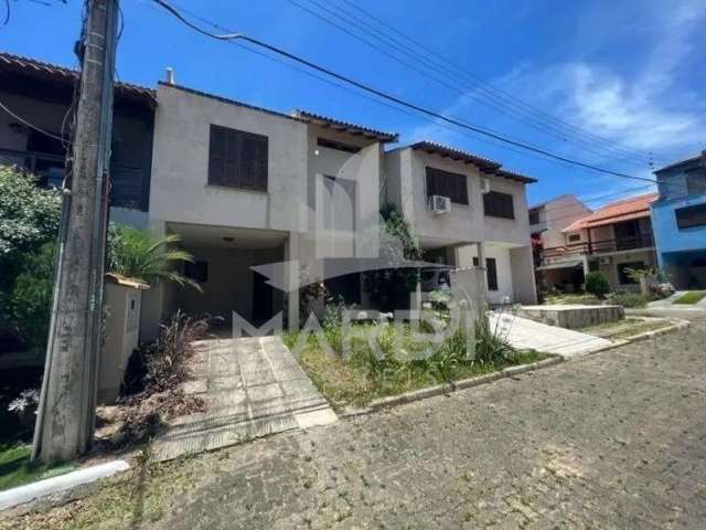 Casa em condomínio fechado com 3 quartos para alugar na Rua Ponciano Pacheco da Silveira, 172, Guarujá, Porto Alegre por R$ 2.200