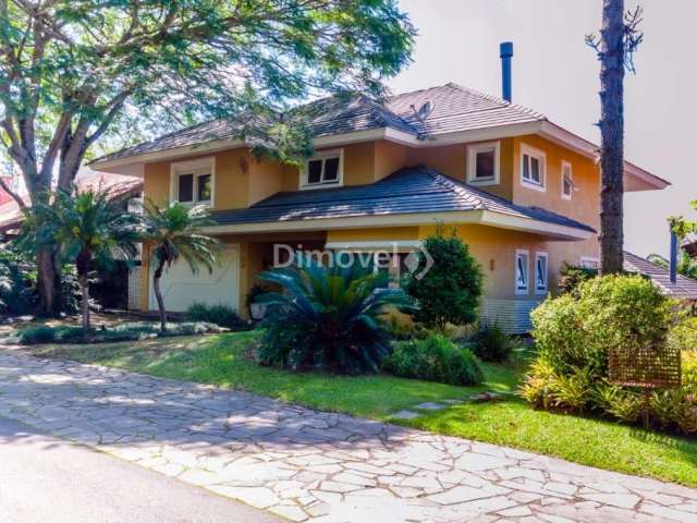 Casa em condomínio fechado com 4 quartos à venda na Avenida da Cavalhada, 5205, Cavalhada, Porto Alegre por R$ 2.940.000