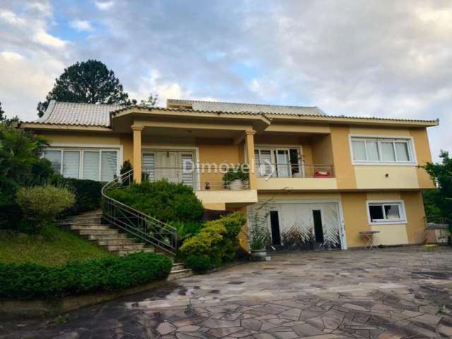 Casa com 4 quartos à venda na MORRO ALTO, 155, Campo Novo, Porto Alegre por R$ 850.000