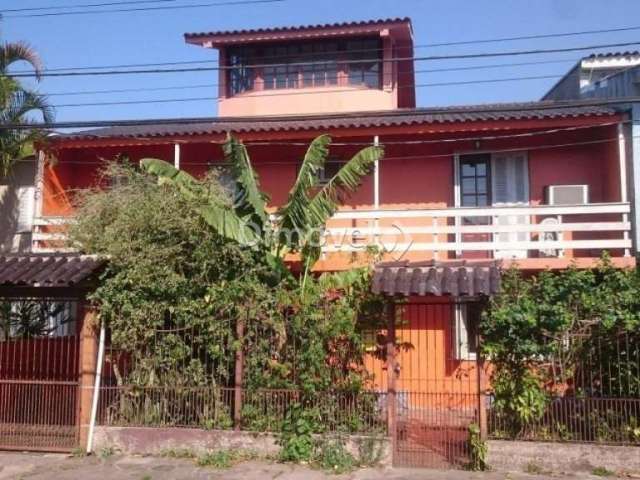 Casa com 4 quartos à venda na Rua Vinte e Um de Agosto, 183, Cavalhada, Porto Alegre por R$ 550.000