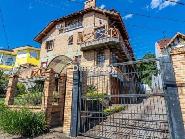 Casa em condomínio fechado com 3 quartos à venda na Rua Doutor Arnaldo da Silva Ferreira, 35, Jardim Isabel, Porto Alegre por R$ 900.000