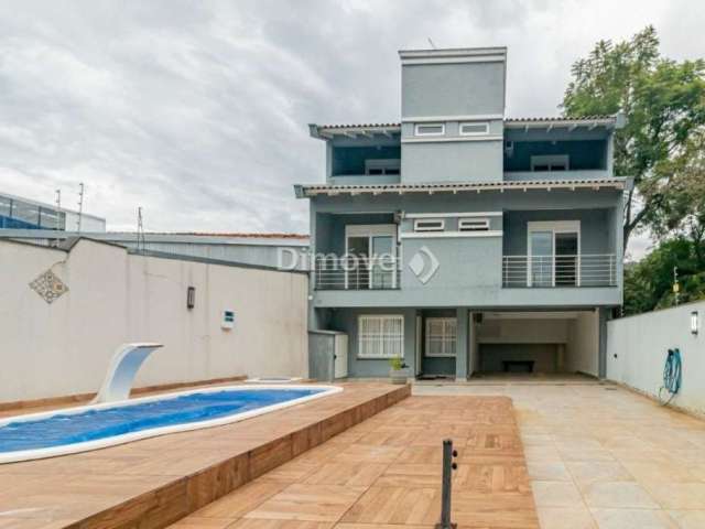 Casa com 4 quartos para alugar na Avenida Nonoai, 724, Nonoai, Porto Alegre por R$ 9.000