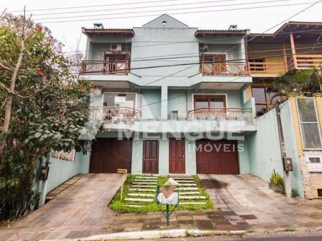 Casa em condomínio fechado com 3 quartos à venda na Rua Antonio Delapieve, 80, Mário Quintana, Porto Alegre por R$ 550.000