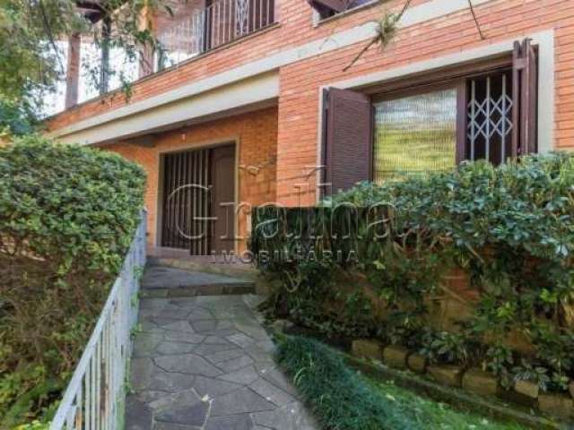 Casa com 4 quartos à venda na Rua Fonseca Guimarães, 34, Medianeira, Porto Alegre por R$ 1.500.000