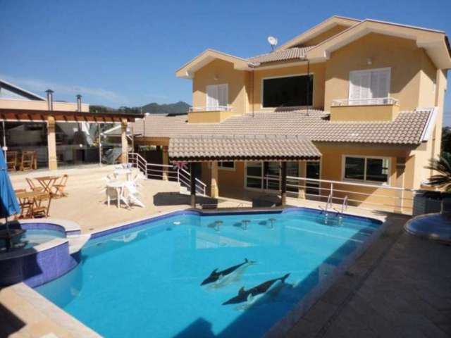 Casa no Condomínio Porto Atibaia Segurança e lazer com 5 suítes, piscina, área gourmet.