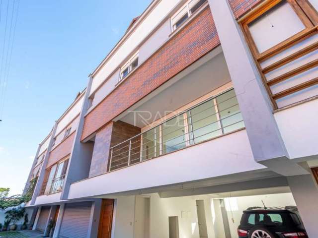 Casa em condomínio fechado com 3 quartos à venda na Avenida Pereira Passos, 795, Vila Assunção, Porto Alegre por R$ 1.300.000