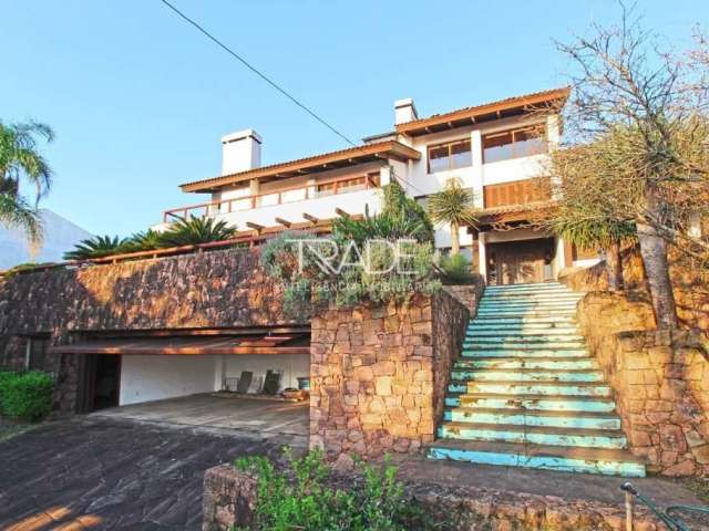 Casa com 4 quartos à venda na Rua Dona Lida Monteiro, 180, Teresópolis, Porto Alegre por R$ 1.300.000