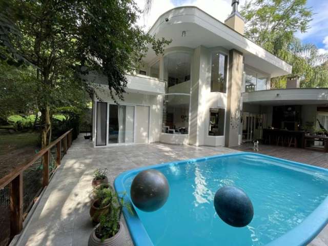 Casa em condomínio fechado com 3 quartos à venda na Rua Quilombo, --, Itacorubi, Florianópolis por R$ 2.950.000